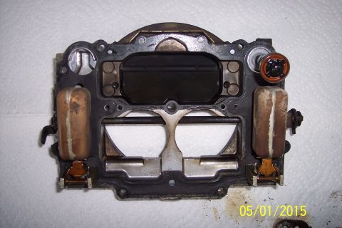 1973 Ford F-250 - Close-up view of a carburetor's float assembly and gasket, likely during a rebuild or maintenance.