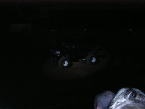 1996 Ford Bronco - A monster truck is visible in the dark, illuminated by a spotlight.