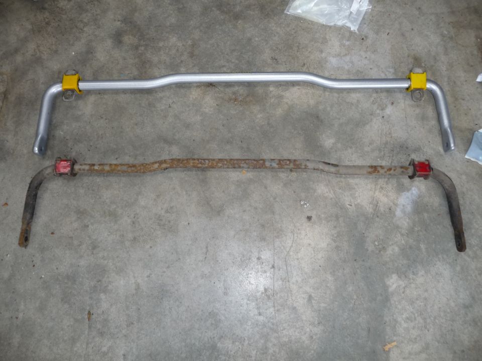 New silver sway bar above rusty old sway bar