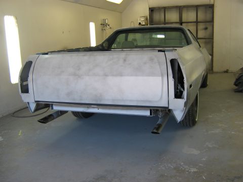 1973 Ford Ranchero - This 1973 Ford Ranchero is in primer, ready for paint, showing its rear end and dual exhaust pipes.