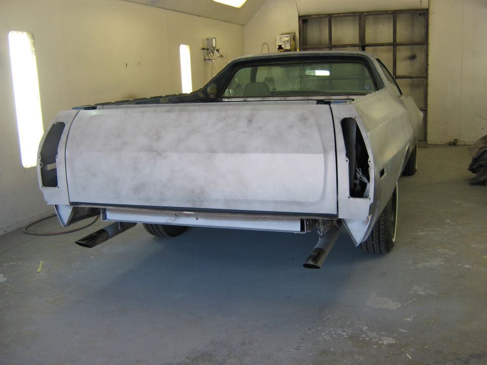 Primer-gray 1973 Ford Ranchero rear view with dual exhaust