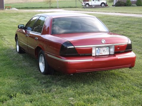 1999 Mercury Grand Marquis - This sedan has a rear view showing its taillights and license plate.