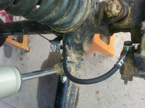1996 Ford Bronco - This photo shows a close-up of a vehicle's suspension and brake system, likely during maintenance or repair.