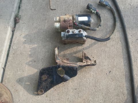 1996 Ford Bronco - This is a disassembled automotive part, likely from a vehicle's engine or suspension system.