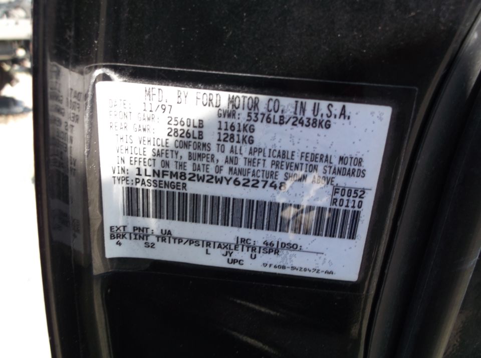 Ford Motor Co. door jamb certification label dated 11/97 with GVWR, GAWR ratings, VIN and barcode