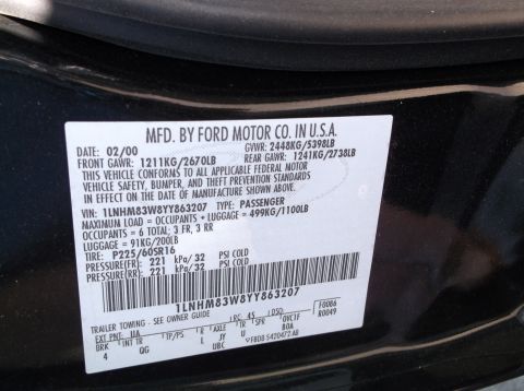 1999 Mercury Grand Marquis - Vehicle identification plate shows a manufacturing date of February 2000.