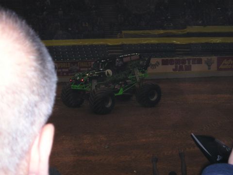 1996 Ford Bronco - Monster truck on dirt arena floor during a Monster Jam event.