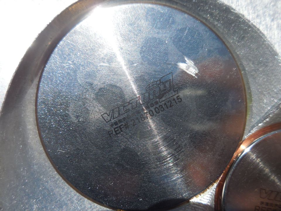Engine cylinder head showing "VICTORY" logo and REF# 21870031215