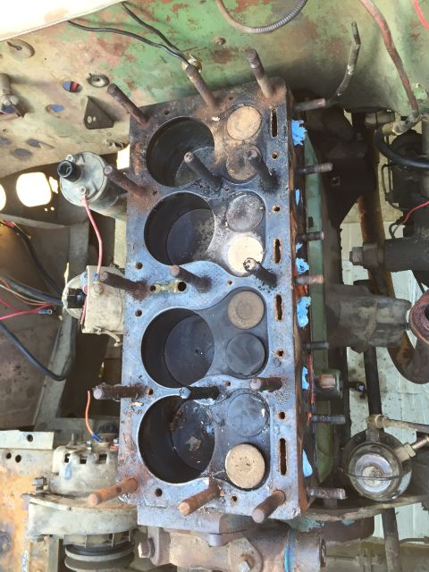 1946 Jeep Willys - Close-up view of a disassembled engine block, showing cylinders and valves, with attached engine components.