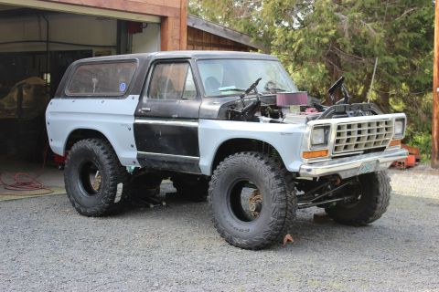 1979 Ford Bronco - This Ford Bronco appears to be undergoing modifications, with its hood up and body panels in primer.
