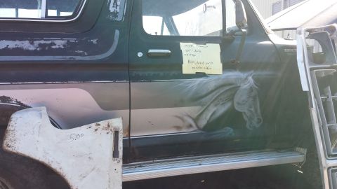 1995 Ford Bronco - This 1978 Ford Bronco features a striking horse mural on its side and a detached fender priced at $5.00.