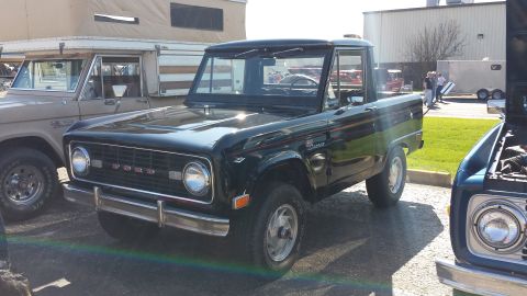 1995 Ford Bronco - First-generation Ford Bronco with a removable top, parked outdoors.