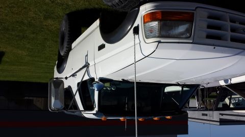 1995 Ford Bronco - This white Ford truck has a spare tire mounted on the passenger side.