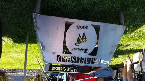 1995 Ford Bronco - A metal sign displays the year 1966 and the Bronco logo, indicating it's related to the vehicle's establishment.