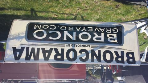1995 Ford Bronco - A banner displays event and website information related to Broncos.