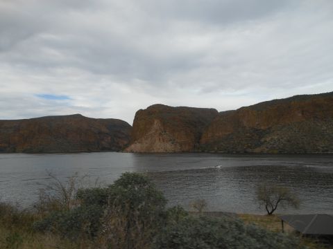 1995 Ford Bronco - A scenic view of a lake surrounded by mountains on an overcast day.