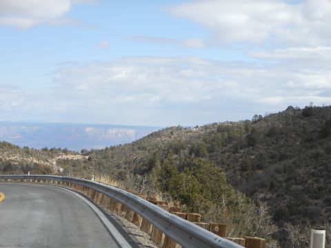 1995 Ford Bronco - A scenic view of a winding road and distant mountains, with a guardrail along the edge.