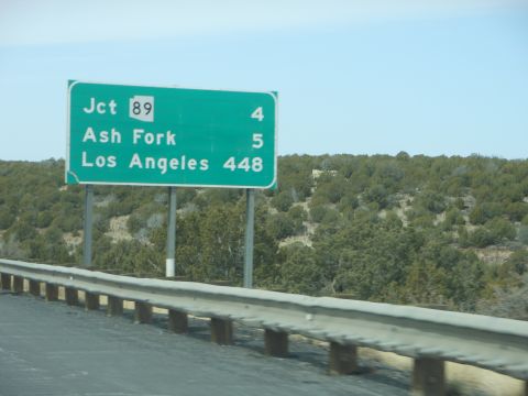 1995 Ford Bronco - A highway sign directs travelers towards Junction 89, Ash Fork, and Los Angeles.