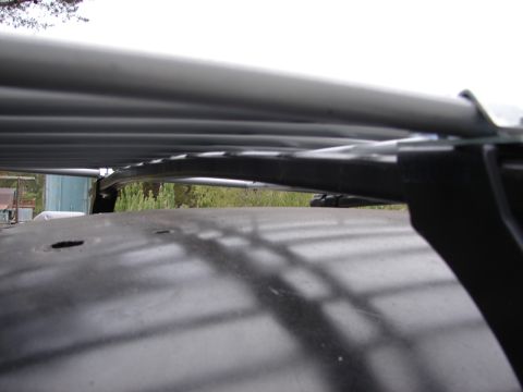 1964 Volkswagen Beetle - Roof rack installed on a vehicle's roof, showing the mounting hardware and rack bars.