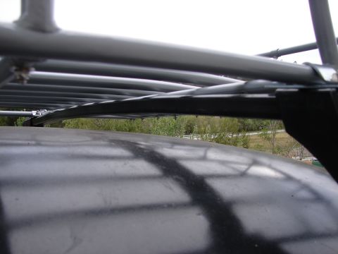 1964 Volkswagen Beetle - This image shows a close-up view of a roof rack system mounted on a vehicle's roof.
