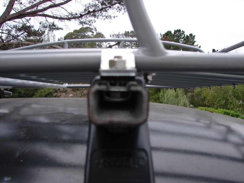 Close-up of a roof rack mount attached to a vehicle's roof