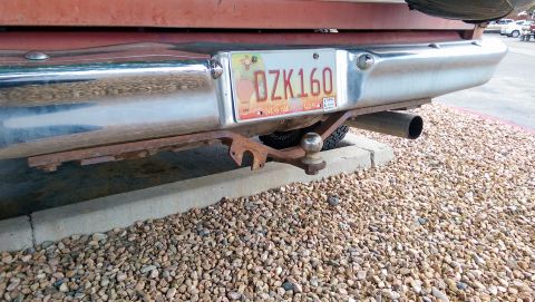 1978 Ford Bronco - Rear view of a 1978 Ford Bronco, showing its bumper, trailer hitch, and a New Mexico license plate.
