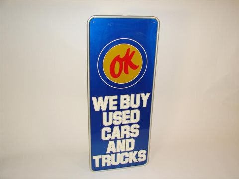 1969 Ford Torino - This sign advertises that the business buys used cars and trucks.