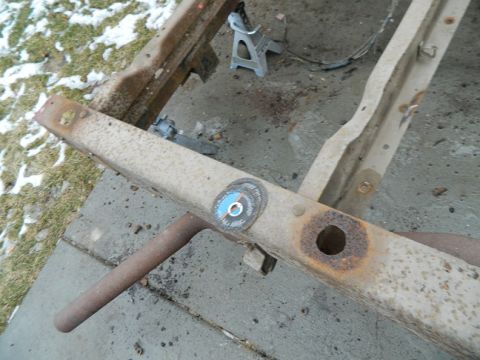 1979 Ford Bronco - A rusty vehicle frame is shown with grinding discs attached, suggesting repair work is underway.