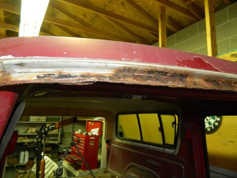 1979 Ford Bronco - The roof edge of a red 1979 Ford Bronco shows significant rust damage.