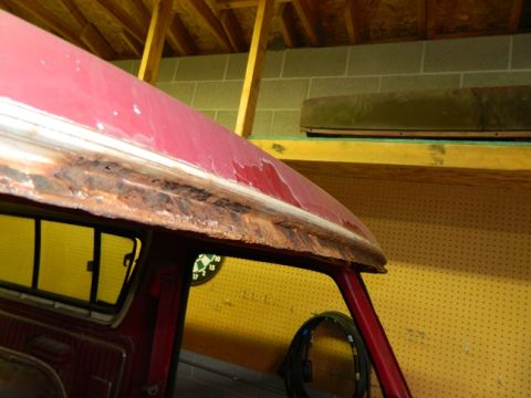1979 Ford Bronco - Severe rust damage is visible along the roofline of this red vehicle.