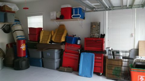 1994 Ford Bronco - Garage storage area contains various items including bins, toolboxes, and car seats.