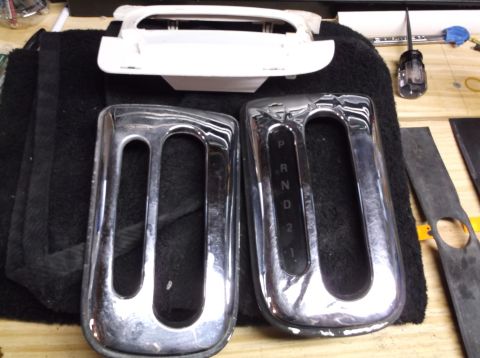 1999 Mercury Grand Marquis - Two chrome gear shifter console trim pieces are shown, one with visible gear indicators P, R, N, D, 2, 1.