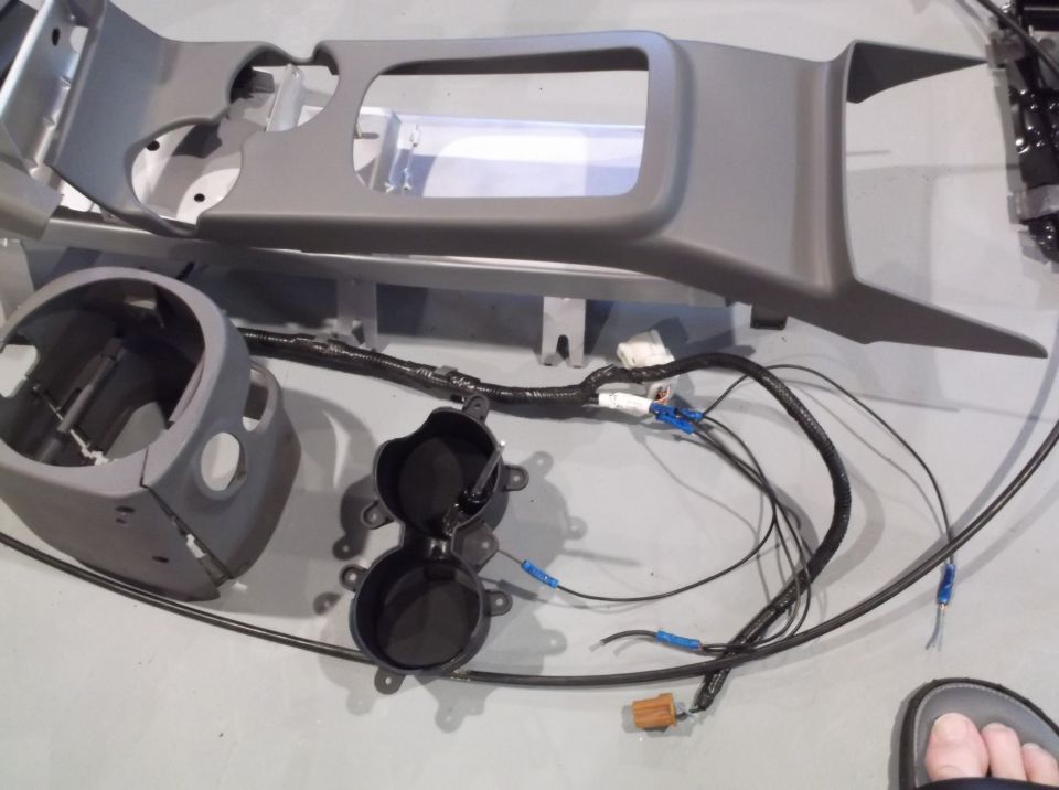 Gray center console trim and wiring harness with cup holder assembly