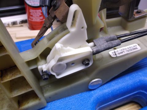 1999 Mercury Grand Marquis - Close-up of a vehicle's gear shifter mechanism, showing internal components and a date stamp.