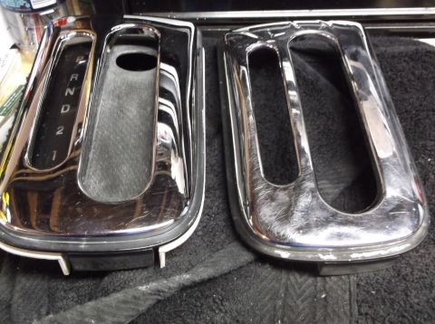 1999 Mercury Grand Marquis - Two chrome trim pieces for a car's center console shifter area are shown. One piece displays gear selector markings.
