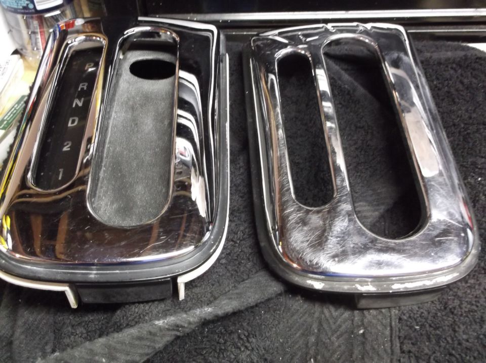 Two chrome trim pieces for a car's center console shifter area. One has gear selector markings P, R, N, D, 2, 1
