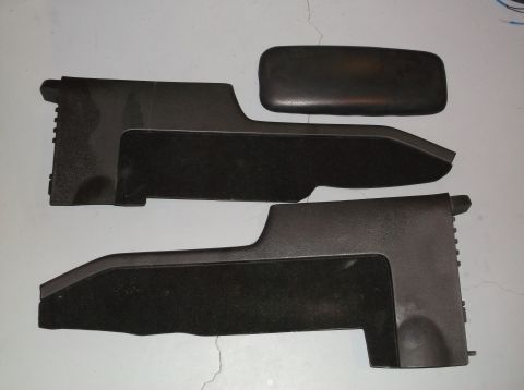 1999 Mercury Grand Marquis - These are interior trim pieces, possibly from a center console area, with a separate armrest pad.