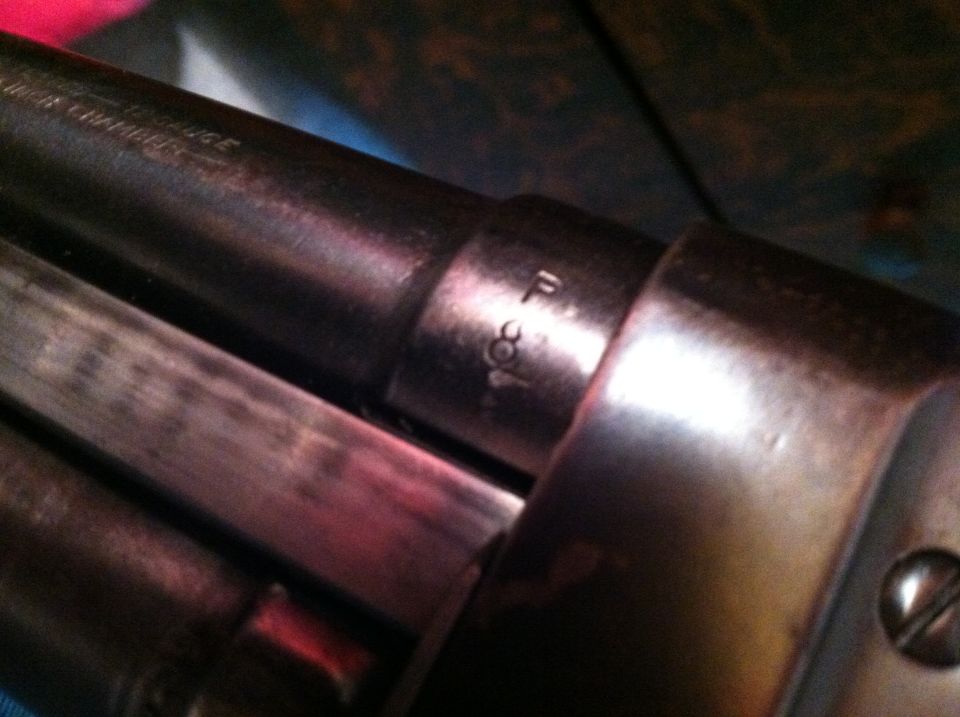 Close-up of firearm barrel with markings 'F 308'