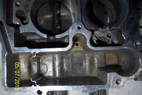 1973 Ford F-250 - The internal components of a carburetor are visible, along with a date stamp and website logo.