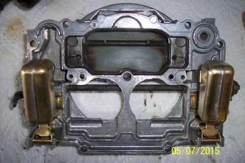 1973 Ford F-250 - Close-up of a carburetor, likely undergoing a rebuild or cleaning.