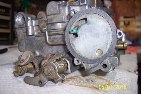 1973 Ford F-250 - Close-up of a carburetor, likely undergoing rebuild or repair.