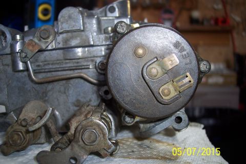 1973 Ford F-250 - A carburetor is shown in detail, with some text visible on a circular component.