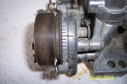 1973 Ford F-250 - Close-up view of a carburetor adjustment mechanism, showing detailed markings for fine-tuning.