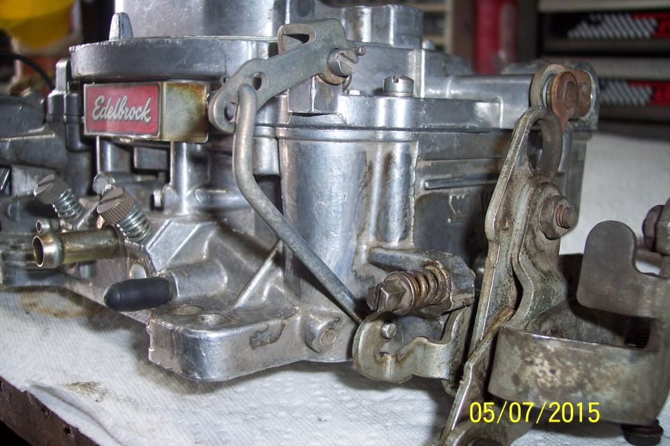 Close-up of an Edelbrock carburetor with a red and silver label