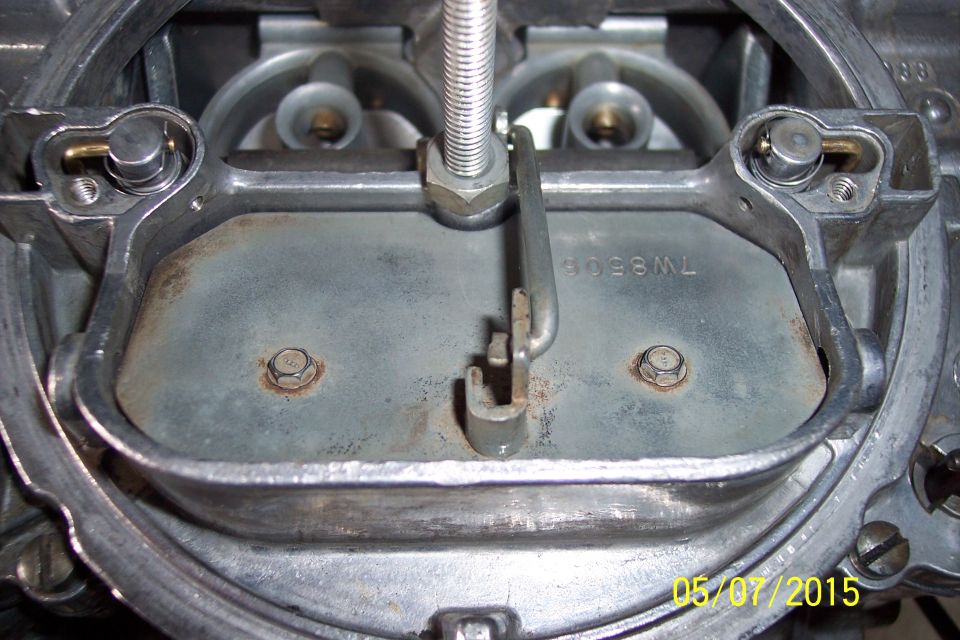 Close-up of a carburetor with visible part number 7W6509ML