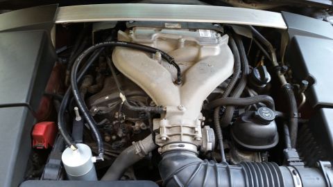 2008 Cadillac CTS - Aftermarket catch can installed in the engine bay, near the intake manifold.
