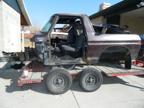 1979 Ford Bronco - Disassembled 1978 Ford Bronco body sits on a trailer, awaiting restoration.