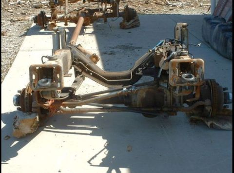 1979 Ford Bronco - Front axle assembly from a 1979 Ford Bronco, showing suspension and braking components.
