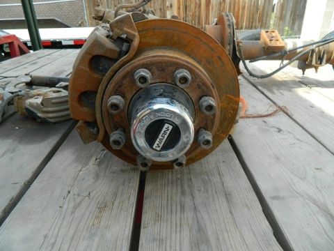1979 Ford Bronco - This is a close-up of a vehicle's axle assembly, a Warn locking hub and brake components.