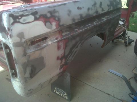 1979 Ford Bronco - Ford Bronco fender undergoing bodywork, with a Ford Trucks mud flap visible.